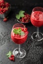 Fresh currant cocktail. Fresh summer cocktail with red currant and ice cubes. Glass of red currant mojito Royalty Free Stock Photo