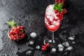 Fresh currant cocktail. Fresh summer cocktail with red currant and ice cubes. Glass of red currant mojito Royalty Free Stock Photo