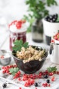 Fresh currants in a ceramic cup: black currants, red currants and white currants