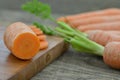 Fresh cut carrot on chopping board on wooden rustic Royalty Free Stock Photo