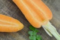 Fresh cut carrots on wooden table, detail Royalty Free Stock Photo