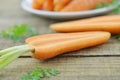 Fresh cut carrots on wooden table, detail Royalty Free Stock Photo