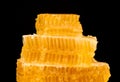 Fresh cut comb honey isolated on black Royalty Free Stock Photo