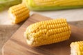Fresh cut corn cob on wooden board Royalty Free Stock Photo