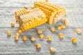 Fresh cut corn cob on wooden table Royalty Free Stock Photo