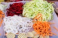 Fresh cut and grated organic vegetables ready for being cooked on a table, zucchini, potatoes, carrots, red onion and white cabbag Royalty Free Stock Photo