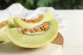 Fresh cut honeydew melon on white wooden table, closeup Royalty Free Stock Photo
