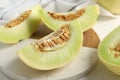 Fresh cut honeydew melon on white wooden table, closeup Royalty Free Stock Photo