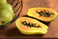 Fresh cut papaya halves with round black seeds Royalty Free Stock Photo