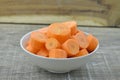 Fresh cut thick carrots on white bowl Royalty Free Stock Photo