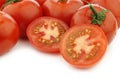 Fresh cut tomato and some whole ones Royalty Free Stock Photo