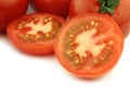 Fresh cut tomato and some whole ones Royalty Free Stock Photo