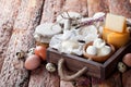 Fresh dairy products: cheese, butter, milk and eggs in wooden box