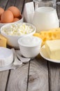 Fresh dairy products. Milk, cheese, brie, Camembert, butter, yogurt, cottage cheese and eggs on wooden table. Royalty Free Stock Photo