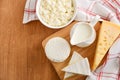 Fresh dairy products. Milk, cheese, brie, camembert and cottage cheese on the wooden background. Royalty Free Stock Photo