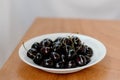 Fresh ripe dark black huge sweet cherries and water drops Royalty Free Stock Photo