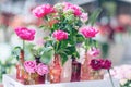 Fresh and decorative artificial roses in vases.Selective focus, Royalty Free Stock Photo