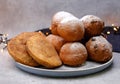 Fresh deep fried doughnut balls and apple turnovers on a plate along with christmas decoration. Royalty Free Stock Photo