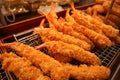 Fresh deepfried japanese tempura shrimps on the street of Osaka