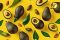 Fresh delicate avocado slices on yellow background