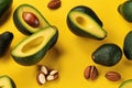 Fresh delicate avocado slices on yellow background