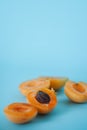 Fresh delicious apricots on a blue background. Royalty Free Stock Photo