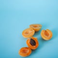 Fresh delicious apricots on a blue background. Royalty Free Stock Photo