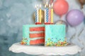 Fresh delicious birthday cake with candles on stand Royalty Free Stock Photo