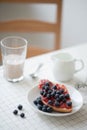 Fresh delicious breakfast with Coffee, crispy croissants, jam on white wooden background. Selective focus. Royalty Free Stock Photo