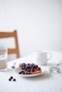 Fresh delicious breakfast with Coffee, crispy croissants, jam on white wooden background. Selective focus. Royalty Free Stock Photo