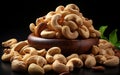 Fresh delicious cashew nuts in bowl isolated on black background Royalty Free Stock Photo