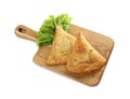 Fresh delicious crispy samosas and lettuce on white background, above view Royalty Free Stock Photo