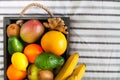 Fresh delicious fruits in a wooden box on the bed. Summer health Royalty Free Stock Photo