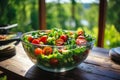 Fresh and delicious green salad with fresh vegetables and herbs served on a white plate Royalty Free Stock Photo