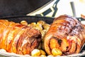 Fresh, delicious grilled porchetta. Grilling porchetta on BBQ