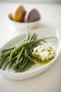 Fresh and delicious Haricots Verts (French Green Beans) with Herb Butter on a plate