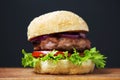 Fresh and delicious home made burger on wooden board. Royalty Free Stock Photo