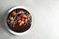 Fresh delicious homemade chocolate cake with berries on gray table, top view Royalty Free Stock Photo