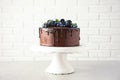 Fresh delicious homemade chocolate cake with berries on table Royalty Free Stock Photo