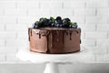 Fresh delicious homemade chocolate cake with berries on table Royalty Free Stock Photo