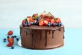 Fresh delicious homemade chocolate cake with berries on table Royalty Free Stock Photo