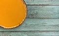 Fresh delicious homemade pumpkin pie on wooden background, top view. Royalty Free Stock Photo