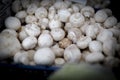 Fresh, delicious organic button mushrooms on a farmers market stall in the UK