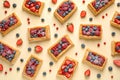 Fresh delicious puff pastry with sweet berries on beige , flat lay