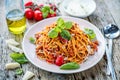 Fresh and delicious spagetti bolognese on wooden table.