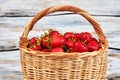 Fresh delicious strawberries in woven basket. Royalty Free Stock Photo