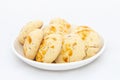 Fresh delicious traditional Nankhatai biscuits in white plate on white isolated background Royalty Free Stock Photo