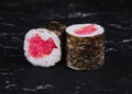 Fresh delicious tuna maki sushi rolls on dark Royalty Free Stock Photo