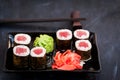 Fresh delicious tuna maki sushi rolls on dark background Royalty Free Stock Photo