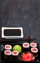 Fresh delicious tuna maki sushi rolls on dark background Royalty Free Stock Photo